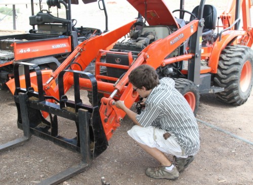 Nephew Derek Repairing the Tractor