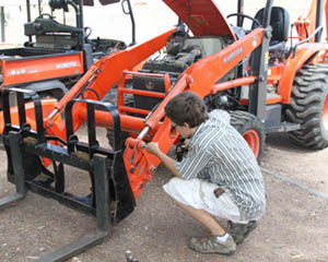 Derek Repairing the Tractor