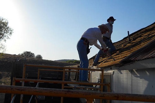 Bernice and Gene Working on the Roof at Sunup